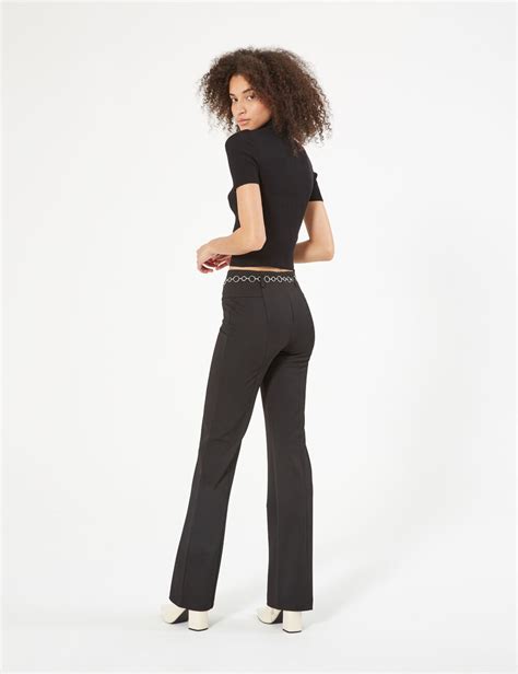 pantalon versace femme noir|Pantalon évasé avec chaîne .